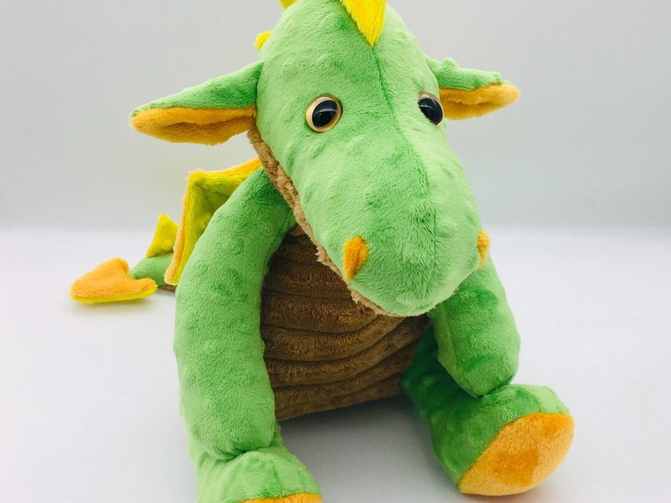 Peluche de dragón suave que brilla en la oscuridad